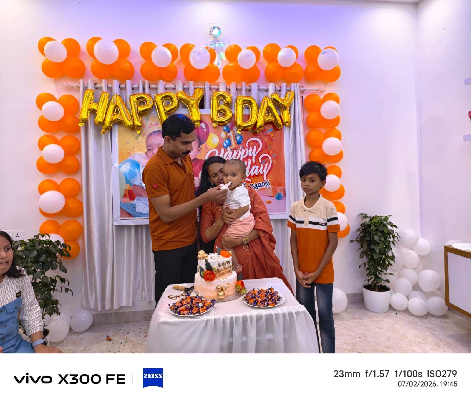 Parents feeding cake to Sanu with Sanjay beside